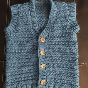Handmade knitted blue children's vest - approximately a size 7